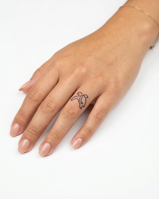 INKY Line Bird semi-permanent tattoo applied on a woman – 0.5 x 0.5 in (1x1 cm) design, realistic ink look, lasts 10 days