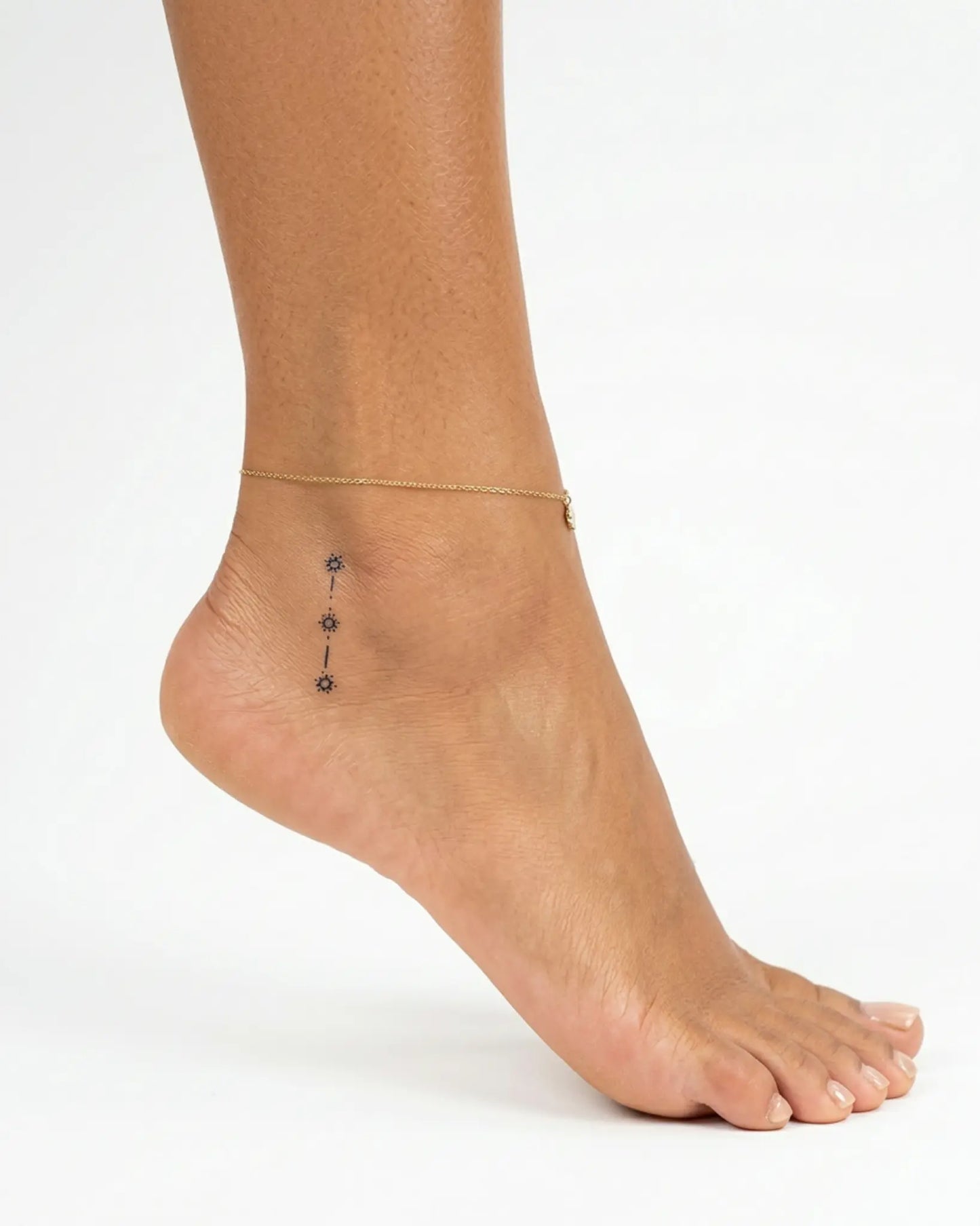 INKY Star Trail semi-permanent tattoo applied on a woman – 2 x 2 in (4x4 cm) design, realistic ink look, lasts 10 days