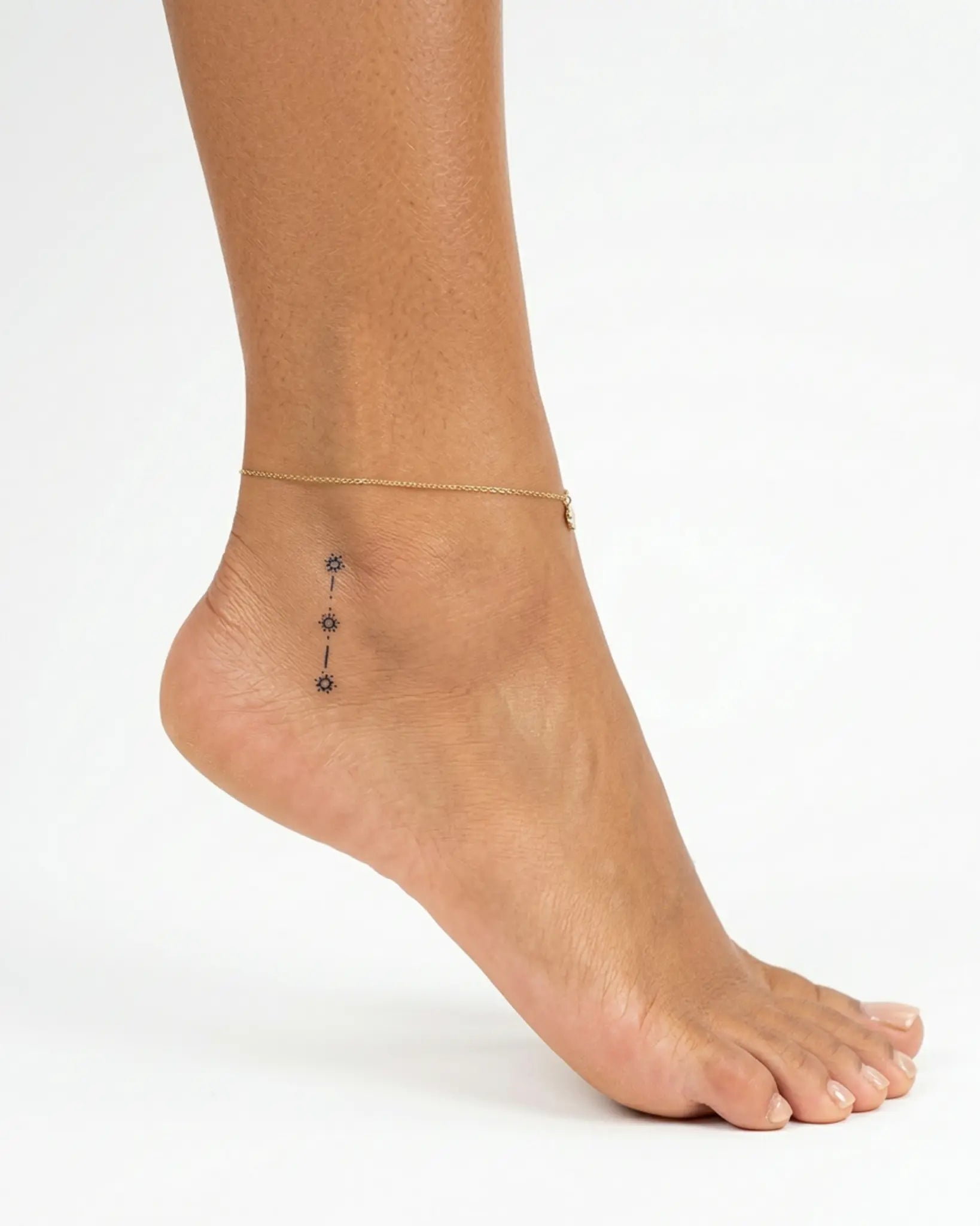 INKY Star Trail semi-permanent tattoo applied on a woman – 2 x 2 in (4x4 cm) design, realistic ink look, lasts 10 days