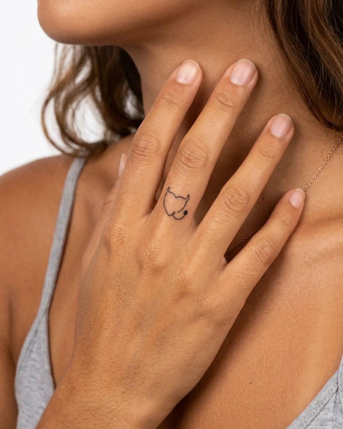 INKY Devil Heart semi-permanent tattoo applied on a woman – 0.5 x 0.5 in (1x1 cm) design, realistic ink look, lasts 10 days
