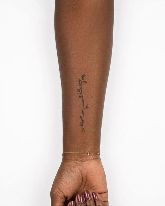 INKY Tiny Blooms semi-permanent tattoo applied on a woman – 2 x 4 in (6x10 cm) design, realistic ink look, lasts 10 days