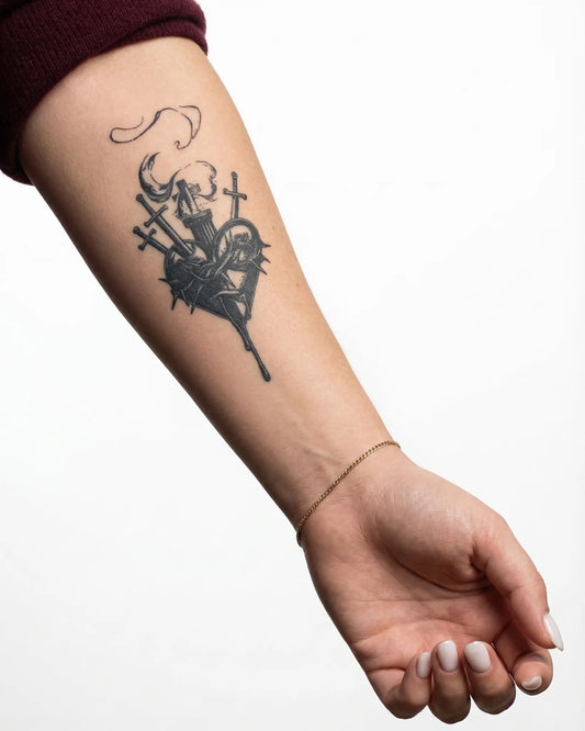INKY Sacred Swords semi-permanent tattoo applied on a woman – 2 x 4 in (6x10 cm) design, realistic ink look, lasts 10 days