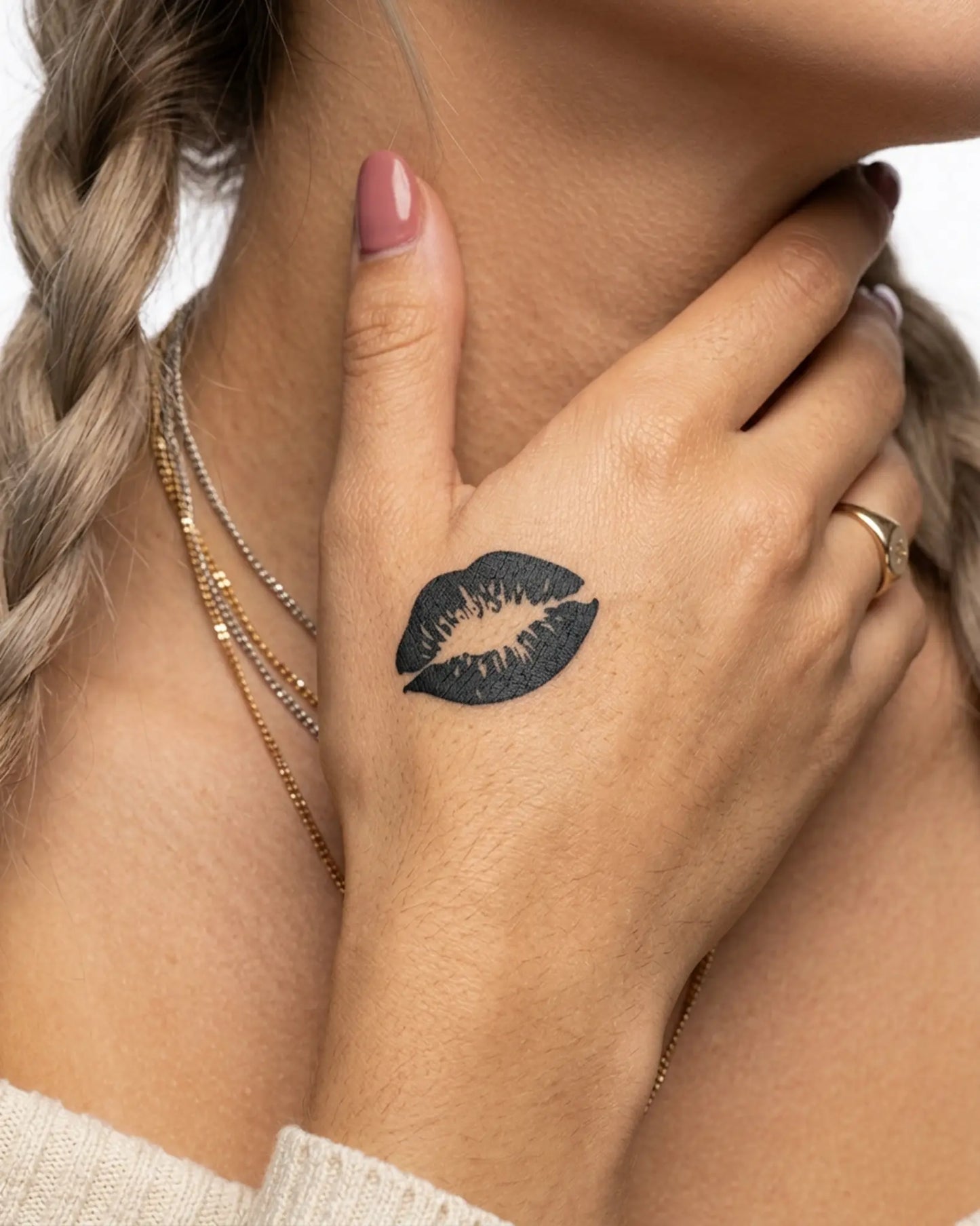 INKY Kiss Mark semi-permanent tattoo applied on a woman – 2 x 2 in (4x4 cm) design, realistic ink look, lasts 10 days