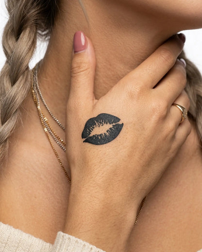 INKY Kiss Mark semi-permanent tattoo applied on a woman – 2 x 2 in (4x4 cm) design, realistic ink look, lasts 10 days