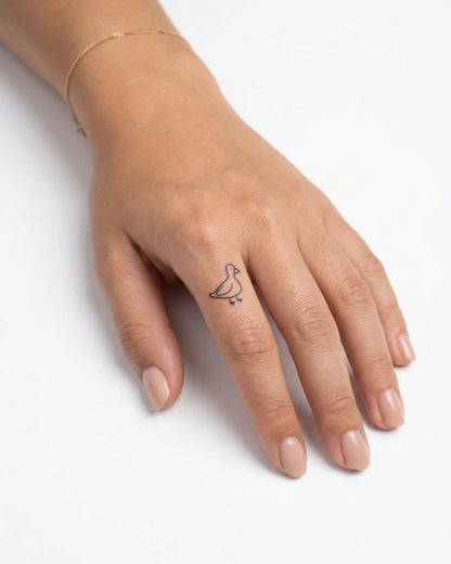 INKY Simple Duck semi-permanent tattoo applied on a woman – 0.5 x 0.5 in (1x1 cm) design, realistic ink look, lasts 10 days