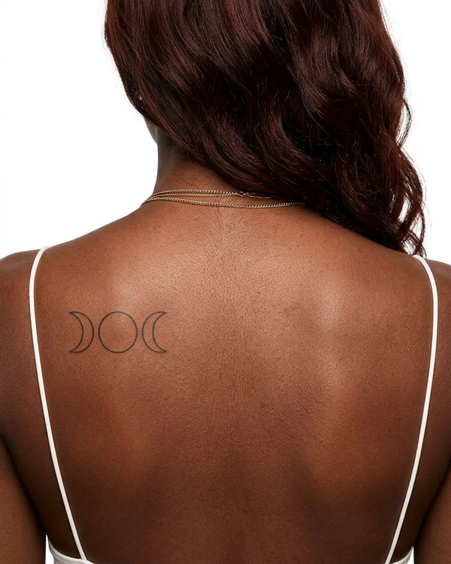 INKY Triple Moon 2 semi-permanent tattoo applied on a woman – 2 x 4 in (6x10 cm) design, realistic ink look, lasts 10 days