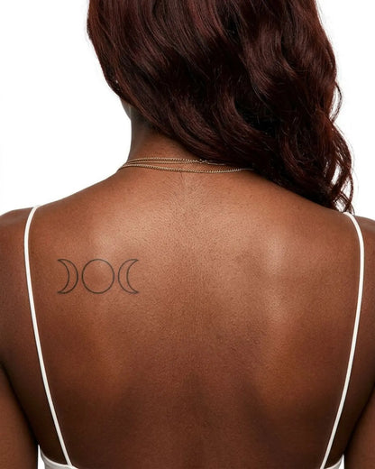 INKY Triple Moon 2 semi-permanent tattoo applied on a woman – 2 x 4 in (6x10 cm) design, realistic ink look, lasts 10 days