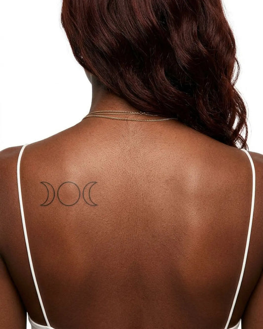 INKY Triple Moon 2 semi-permanent tattoo applied on a woman – 2 x 4 in (6x10 cm) design, realistic ink look, lasts 10 days