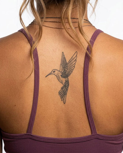 INKY Hummingbird semi-permanent tattoo applied on a woman – 2 x 4 in (6x10 cm) design, realistic ink look, lasts 10 days