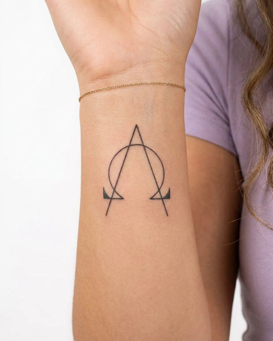 INKY AlphaOmega semi-permanent tattoo applied on a woman – 2 x 2 in (4x4 cm) design, realistic ink look, lasts 10 days