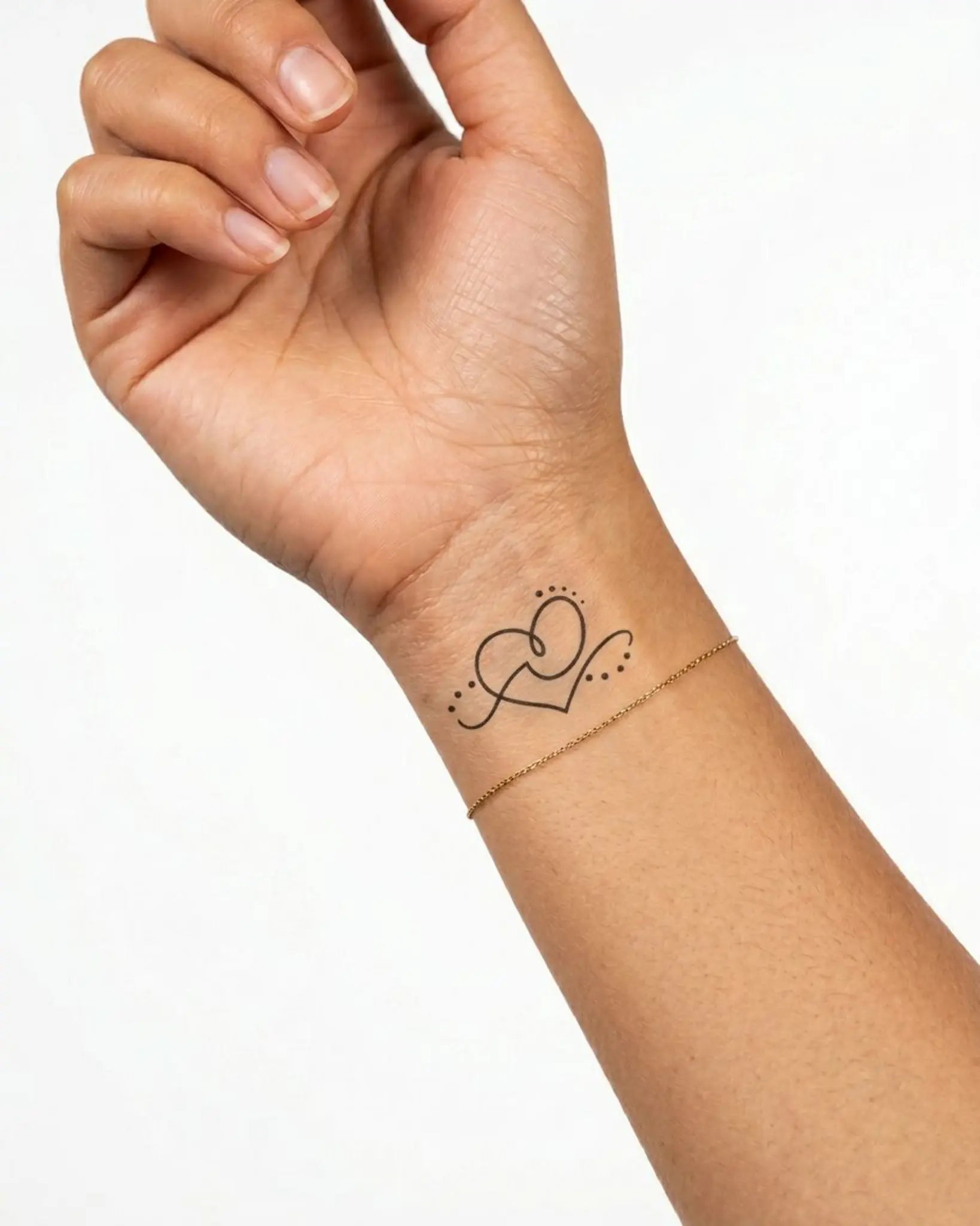 INKY Love Line semi-permanent tattoo applied on a woman – 2 x 2 in (4x4 cm) design, realistic ink look, lasts 10 days