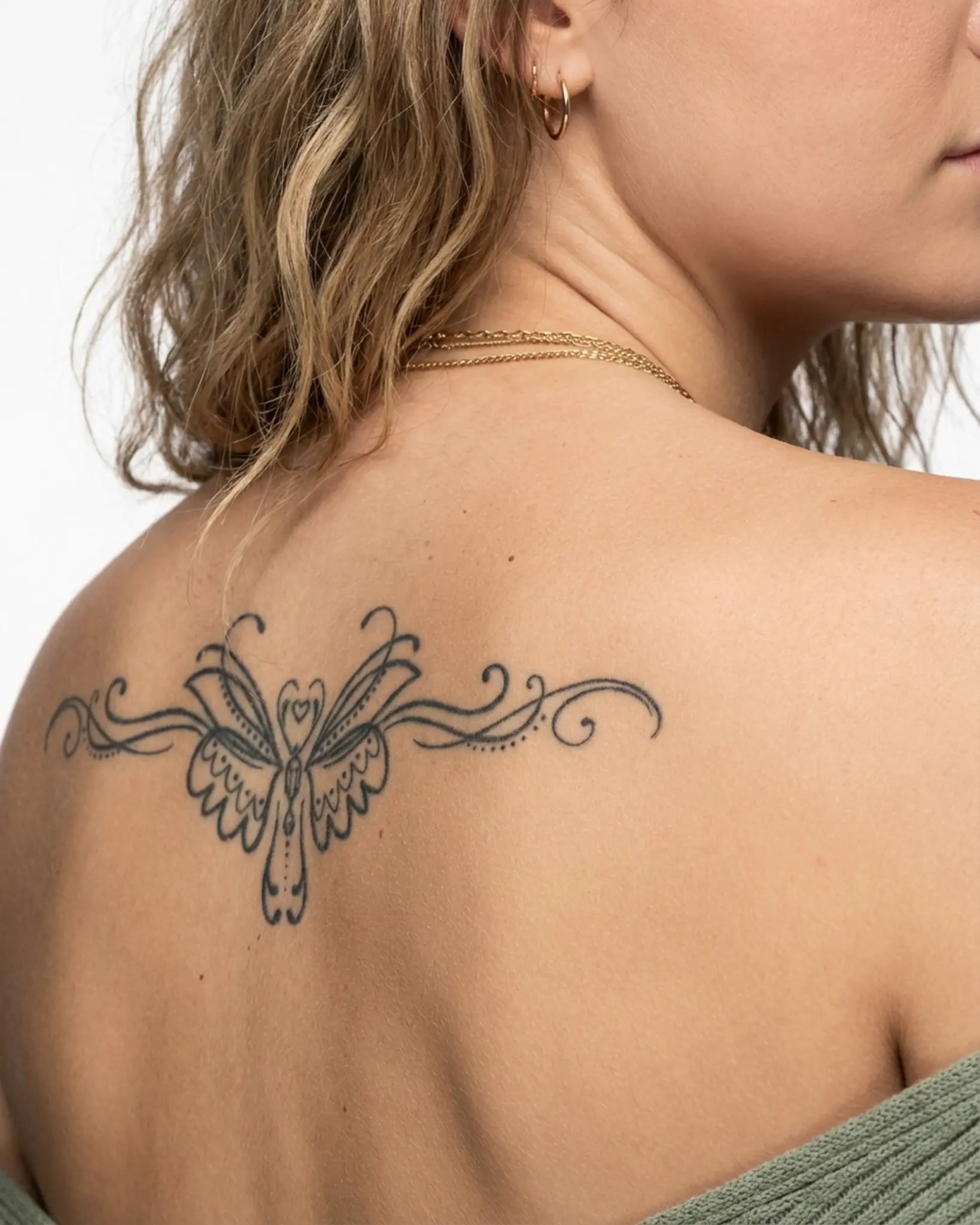 INKY Heart Swirl semi-permanent tattoo applied on a woman – 4 x 8 in (11x20 cm) design, realistic ink look, lasts 10 days