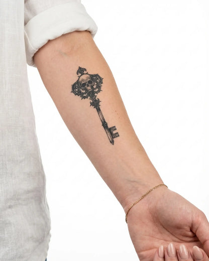INKY Skull Key semi-permanent tattoo applied on a woman – 2 x 4 in (6x10 cm) design, realistic ink look, lasts 10 days