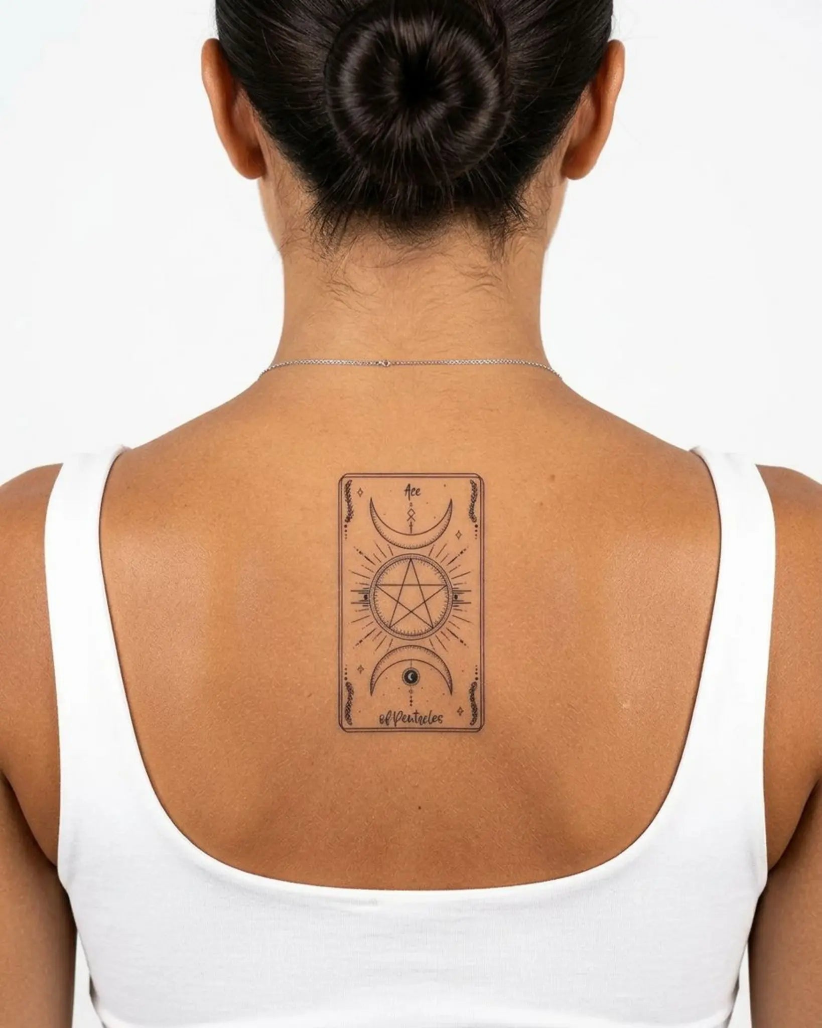 INKY Ace Pentacles semi-permanent tattoo applied on a woman – 2 x 4 in (6x10 cm) design, realistic ink look, lasts 10 days
