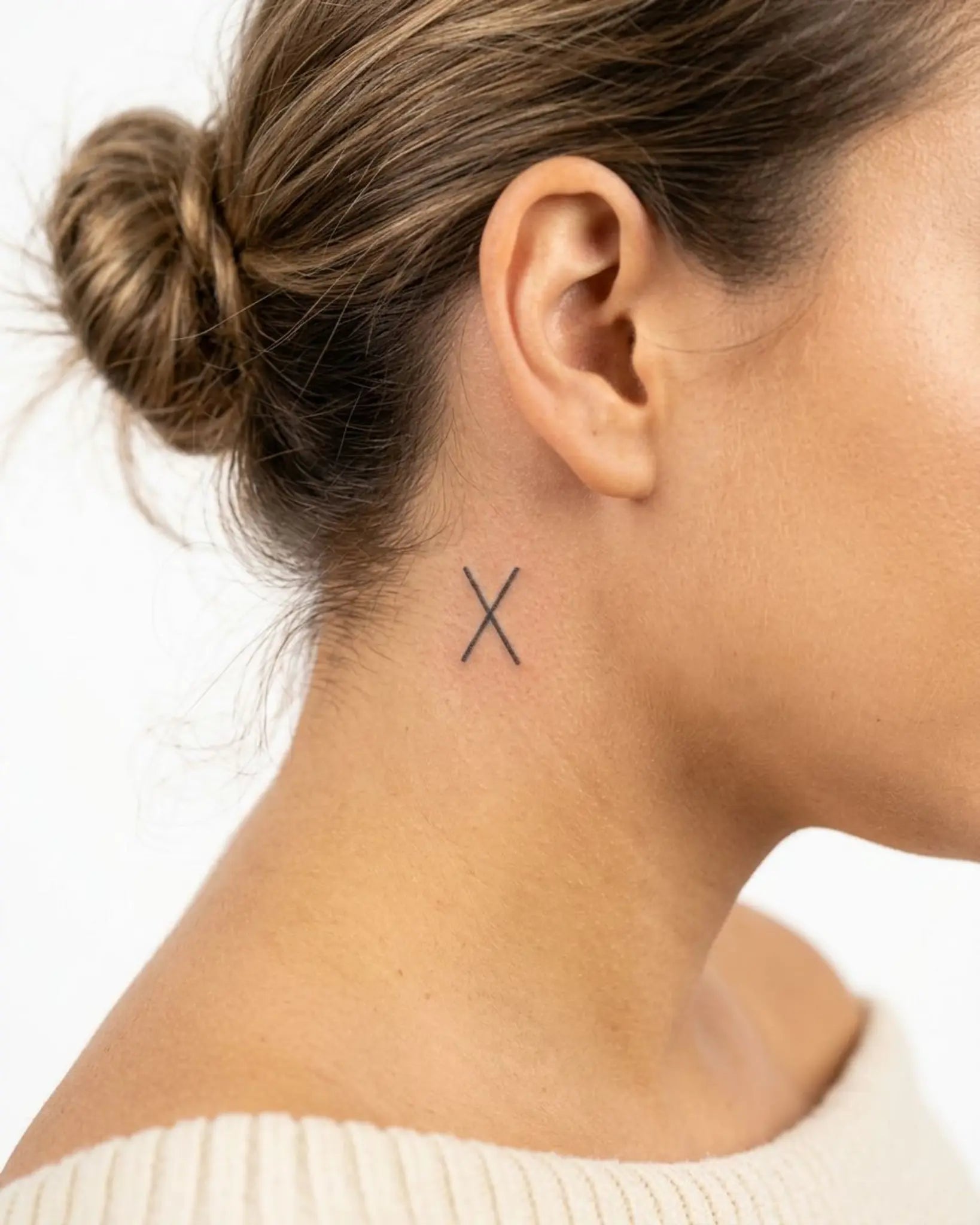 INKY X Mark semi-permanent tattoo applied on a woman – 0.5 x 0.5 in (1x1 cm) design, realistic ink look, lasts 10 days