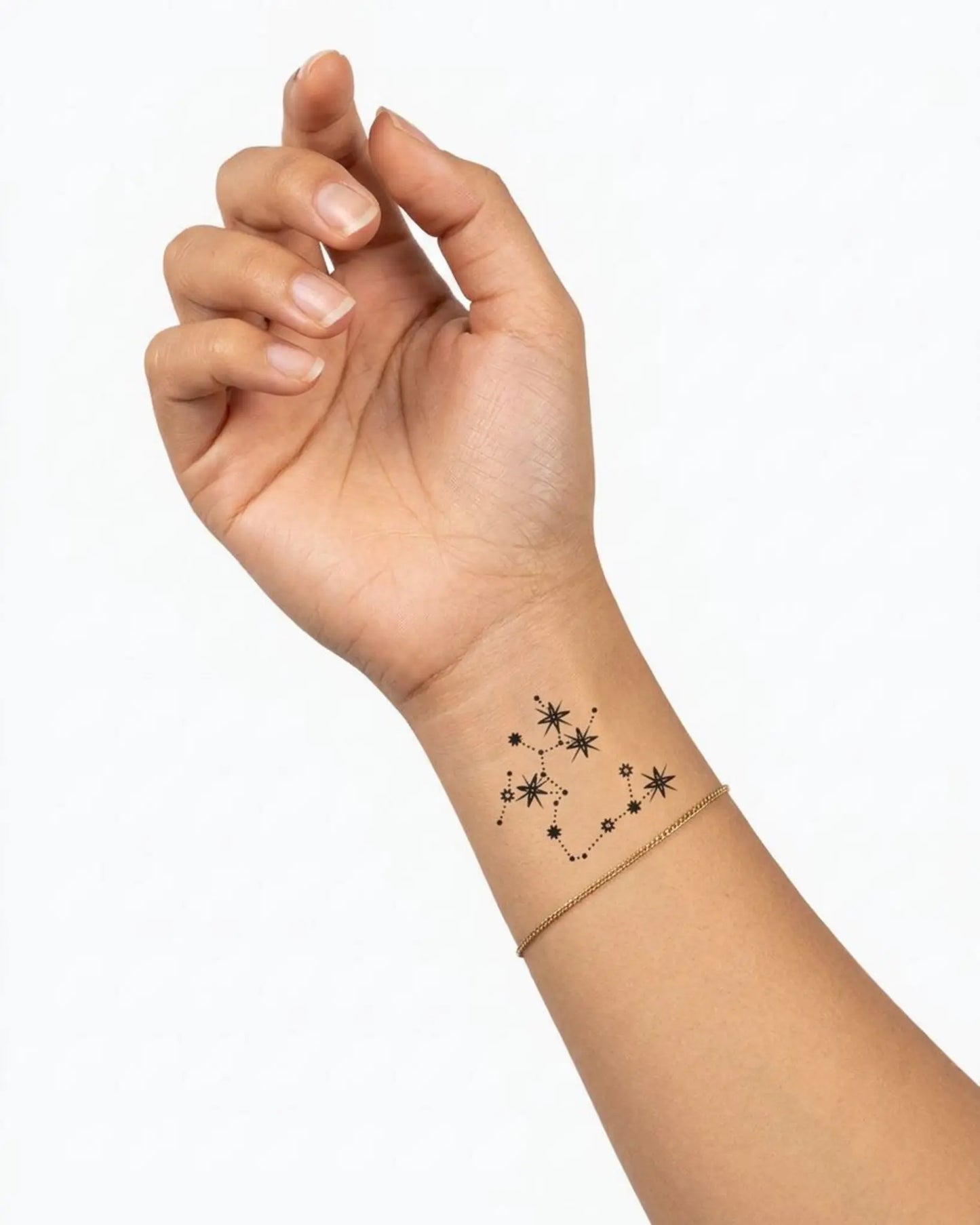 INKY Constellation Sagittarius semi-permanent tattoo applied on a woman – 2 x 2 in (4x4 cm) design, realistic ink look, lasts 10 days