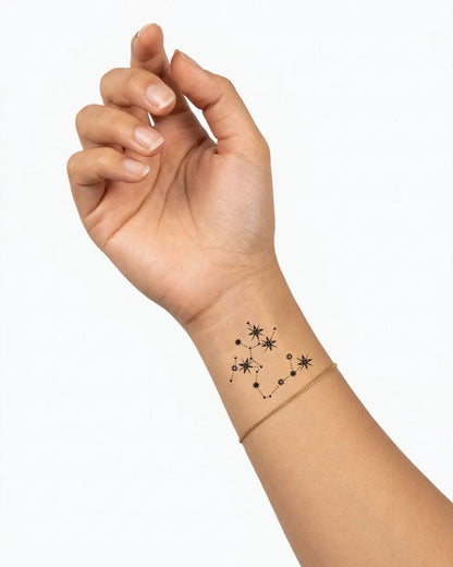 INKY Constellation Sagittarius semi-permanent tattoo applied on a woman – 2 x 2 in (4x4 cm) design, realistic ink look, lasts 10 days