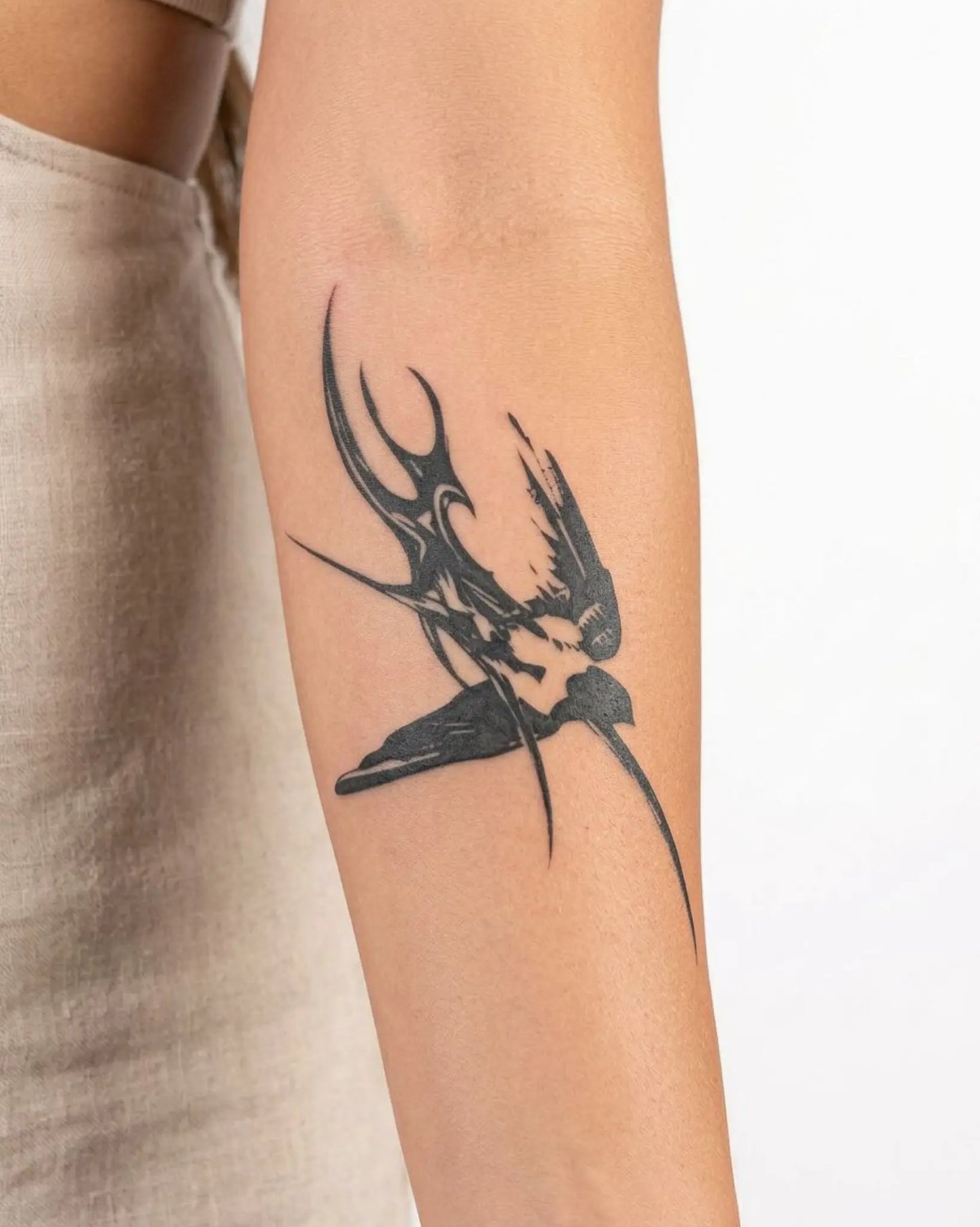 INKY Dark Swirl semi-permanent tattoo applied on a woman – 3 x 4 in (7x10 cm) design, realistic ink look, lasts 10 days