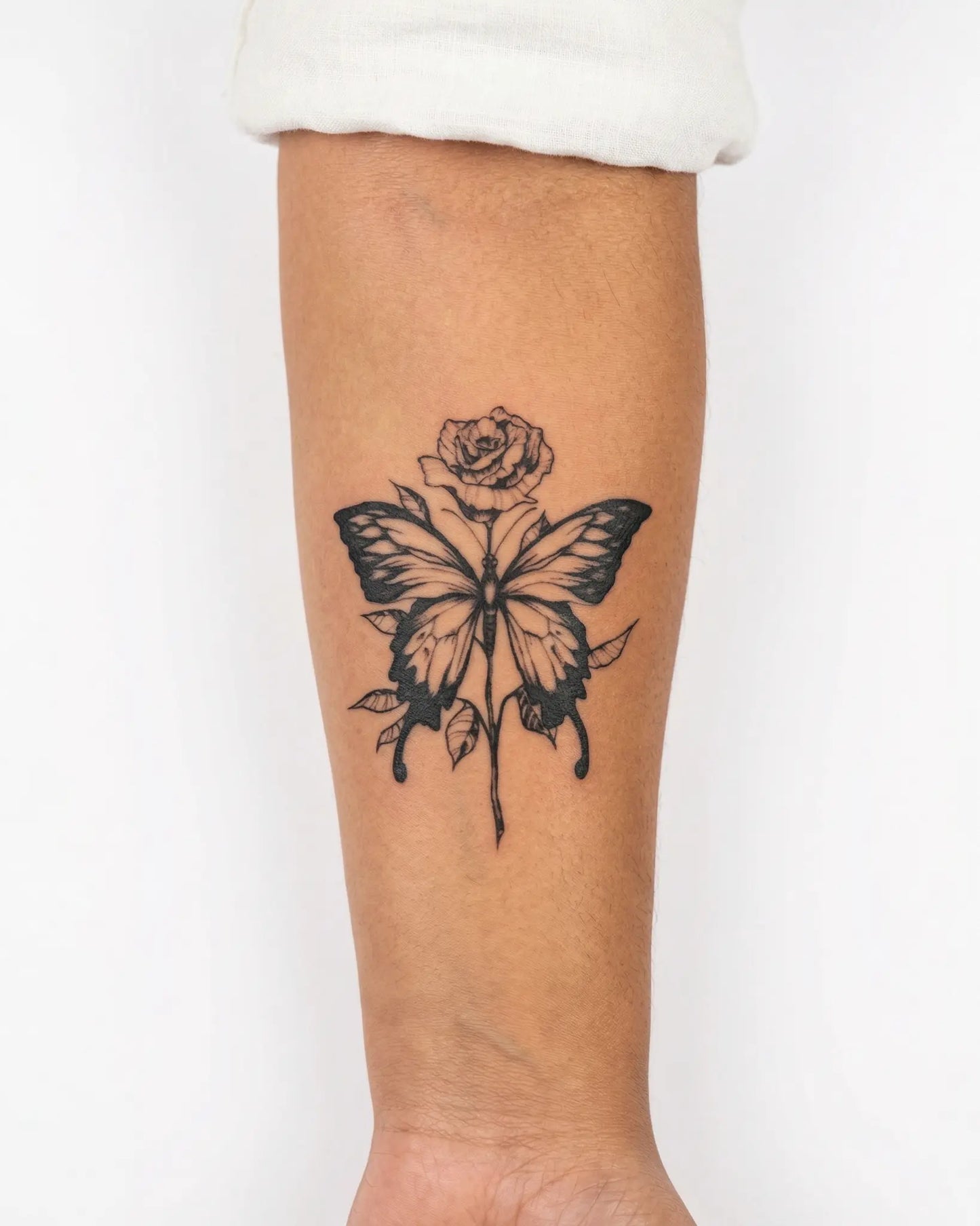 INKY Flora Fly semi-permanent tattoo applied on a woman – 3 x 4 in (7x10 cm) design, realistic ink look, lasts 10 days