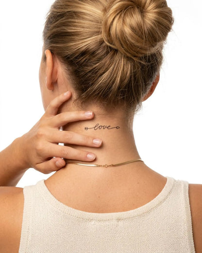 INKY Love Arrow 3 semi-permanent tattoo applied on a woman – 2 x 2 in (4x4 cm) design, realistic ink look, lasts 10 days