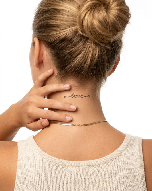INKY Love Arrow 3 semi-permanent tattoo applied on a woman – 2 x 2 in (4x4 cm) design, realistic ink look, lasts 10 days