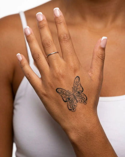 INKY Swirl Butterf semi-permanent tattoo applied on a woman – 2 x 2 in (4x4 cm) design, realistic ink look, lasts 10 days