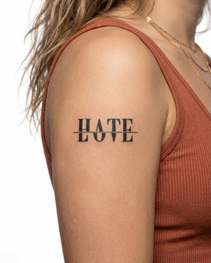 INKY Love Hate 2 semi-permanent tattoo applied on a woman – 2 x 4 in (6x10 cm) design, realistic ink look, lasts 10 days