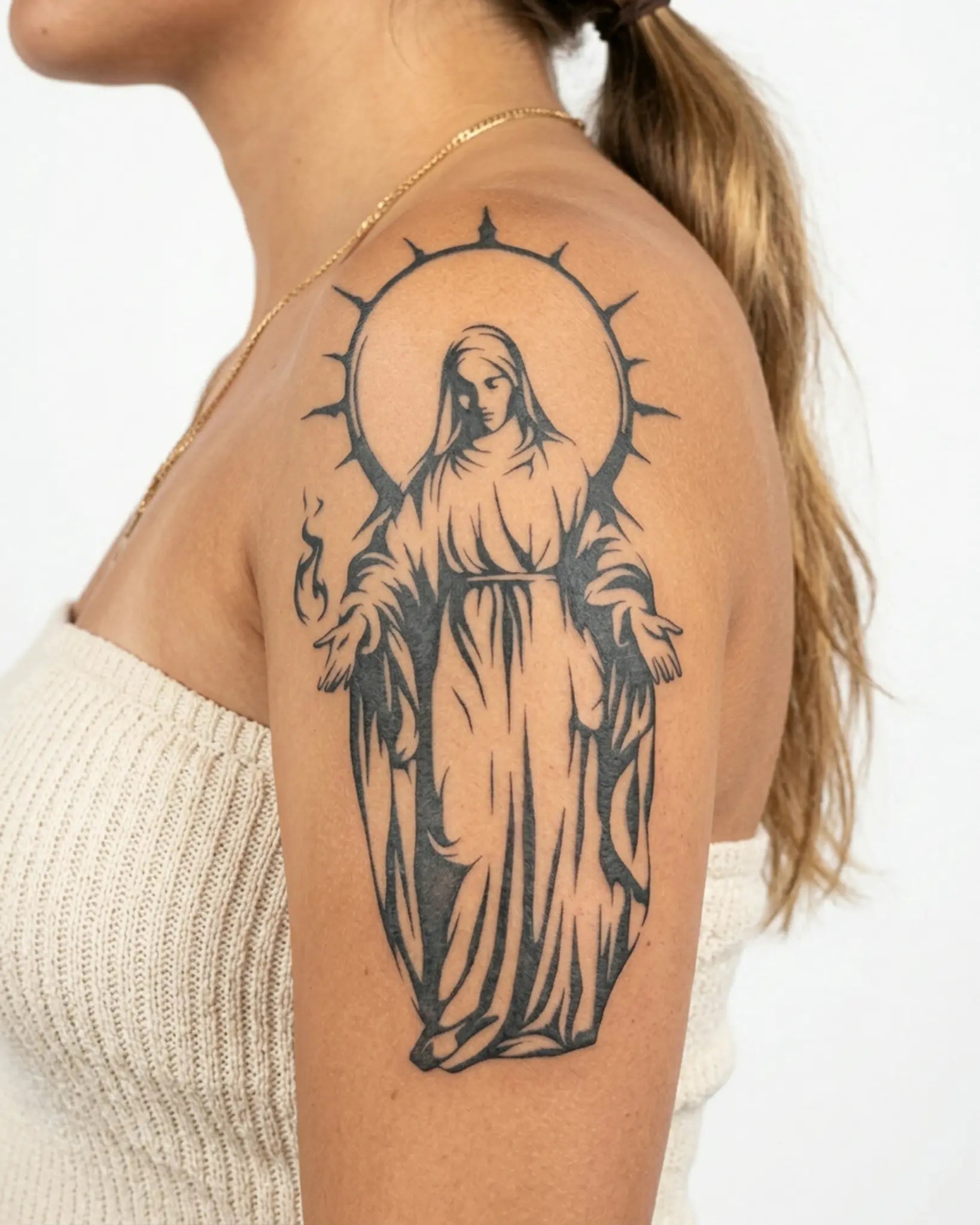 INKY Sacred Icon semi-permanent tattoo applied on a woman – 4 x 7 in (10x17 cm) design, realistic ink look, lasts 10 days