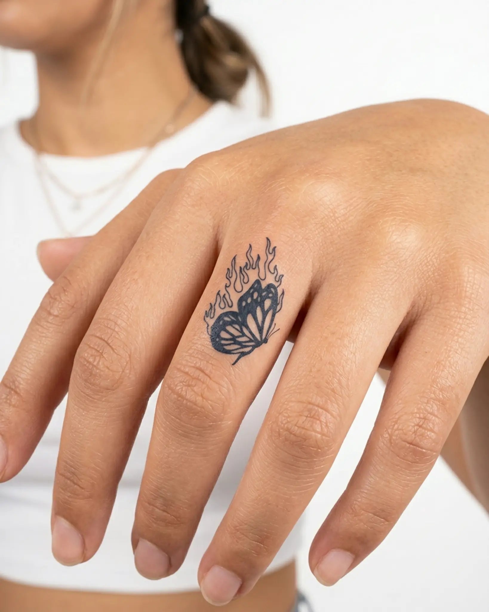 INKY Flame Butte semi-permanent tattoo applied on a woman – 0.5 x 0.5 in (1x1 cm) design, realistic ink look, lasts 10 days