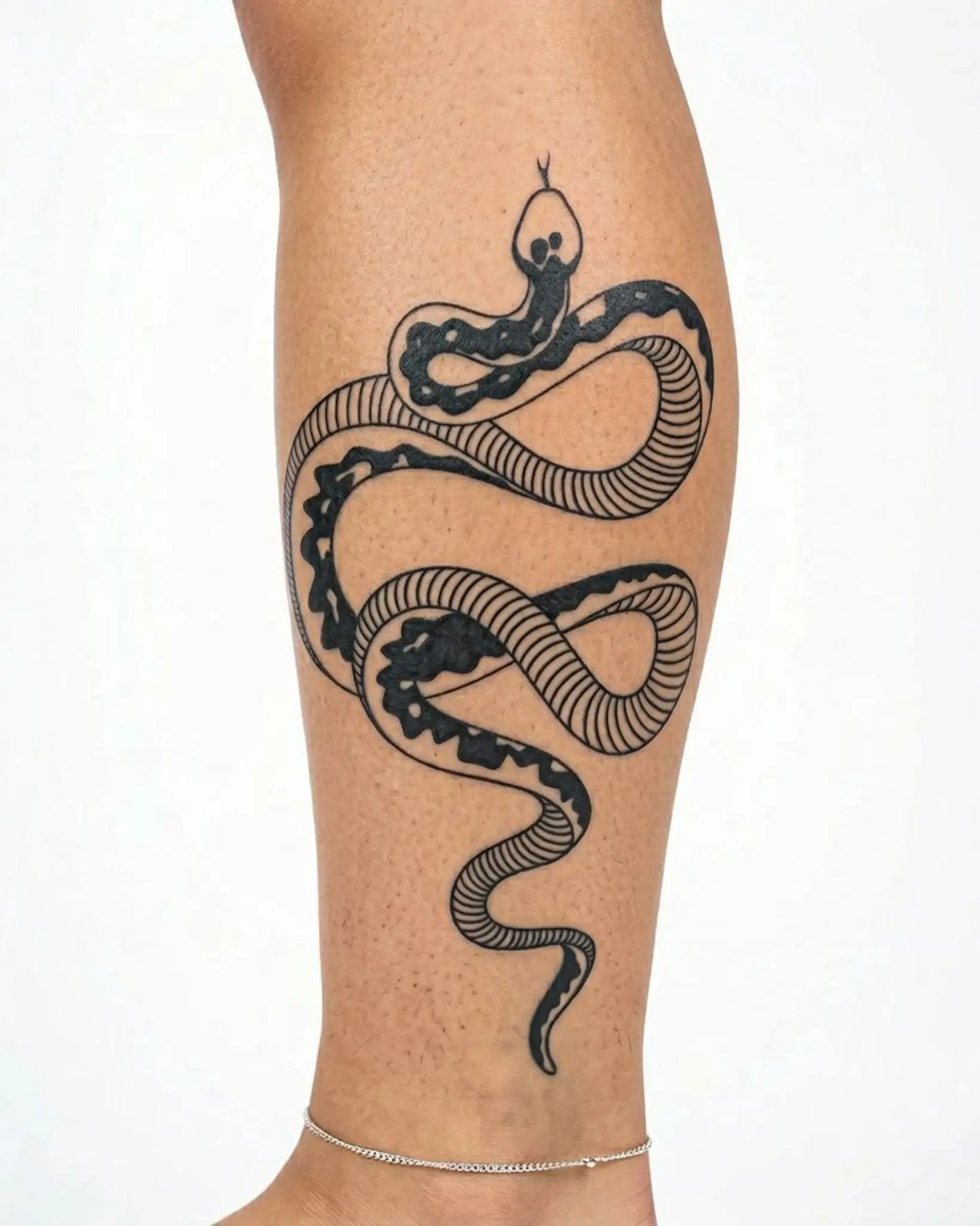 INKY Coiled Snake 2 semi-permanent tattoo applied on a woman – 4 x 7 in (10x17 cm) design, realistic ink look, lasts 10 days