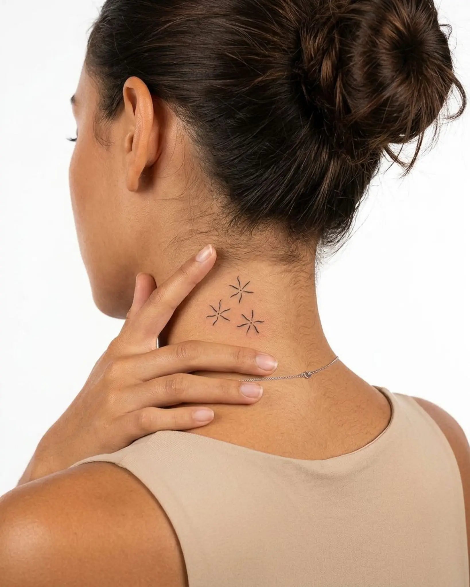 INKY Wavy Stars semi-permanent tattoo applied on a woman – 2 x 2 in (4x4 cm) design, realistic ink look, lasts 10 days