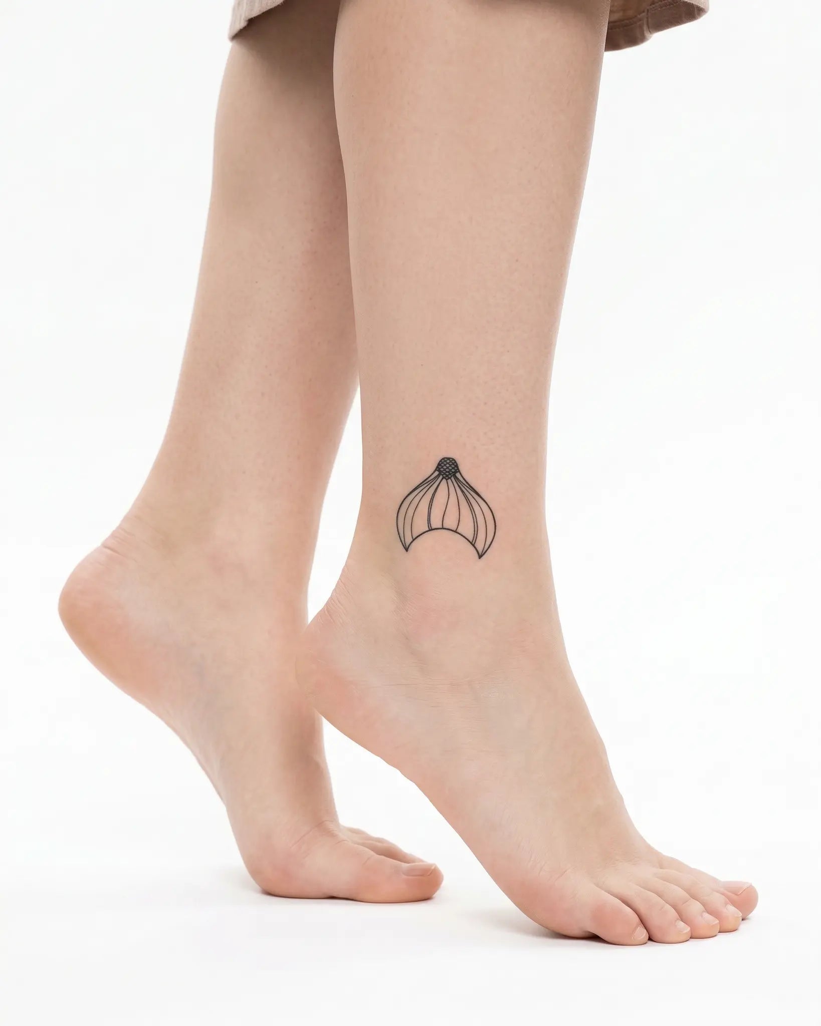 INKY Mermaid Tail semi-permanent tattoo applied on a woman – 2 x 2 in (4x4 cm) design, realistic ink look, lasts 10 days