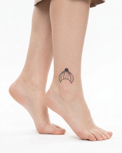 INKY Mermaid Tail semi-permanent tattoo applied on a woman – 2 x 2 in (4x4 cm) design, realistic ink look, lasts 10 days