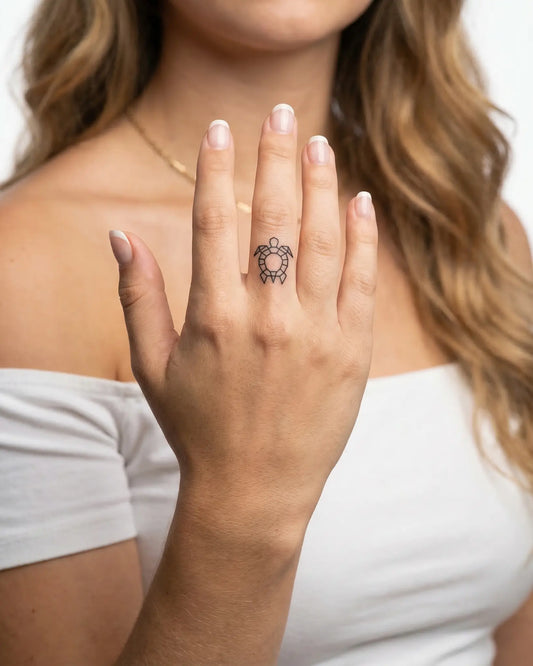 INKY Geo Turtle semi-permanent tattoo applied on a woman – 0.5 x 0.5 in (1x1 cm) design, realistic ink look, lasts 10 days