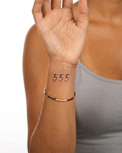 INKY Angel 555 semi-permanent tattoo applied on a woman – 2 x 2 in (4x4 cm) design, realistic ink look, lasts 10 days