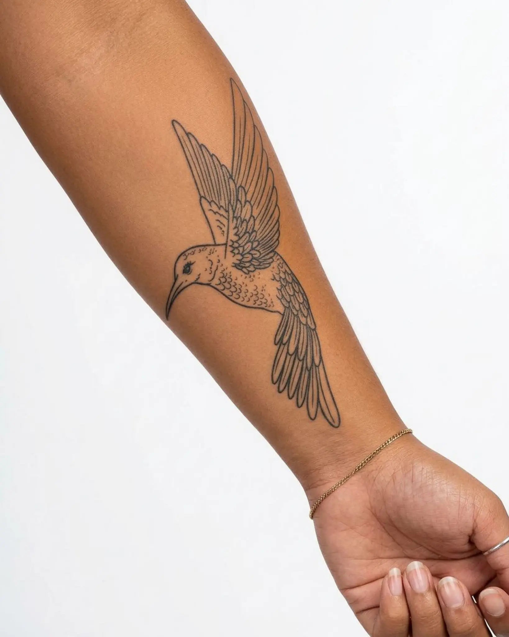 INKY Hummingbird 2 semi-permanent tattoo applied on a woman – 4 x 7 in (10x17 cm) design, realistic ink look, lasts 10 days