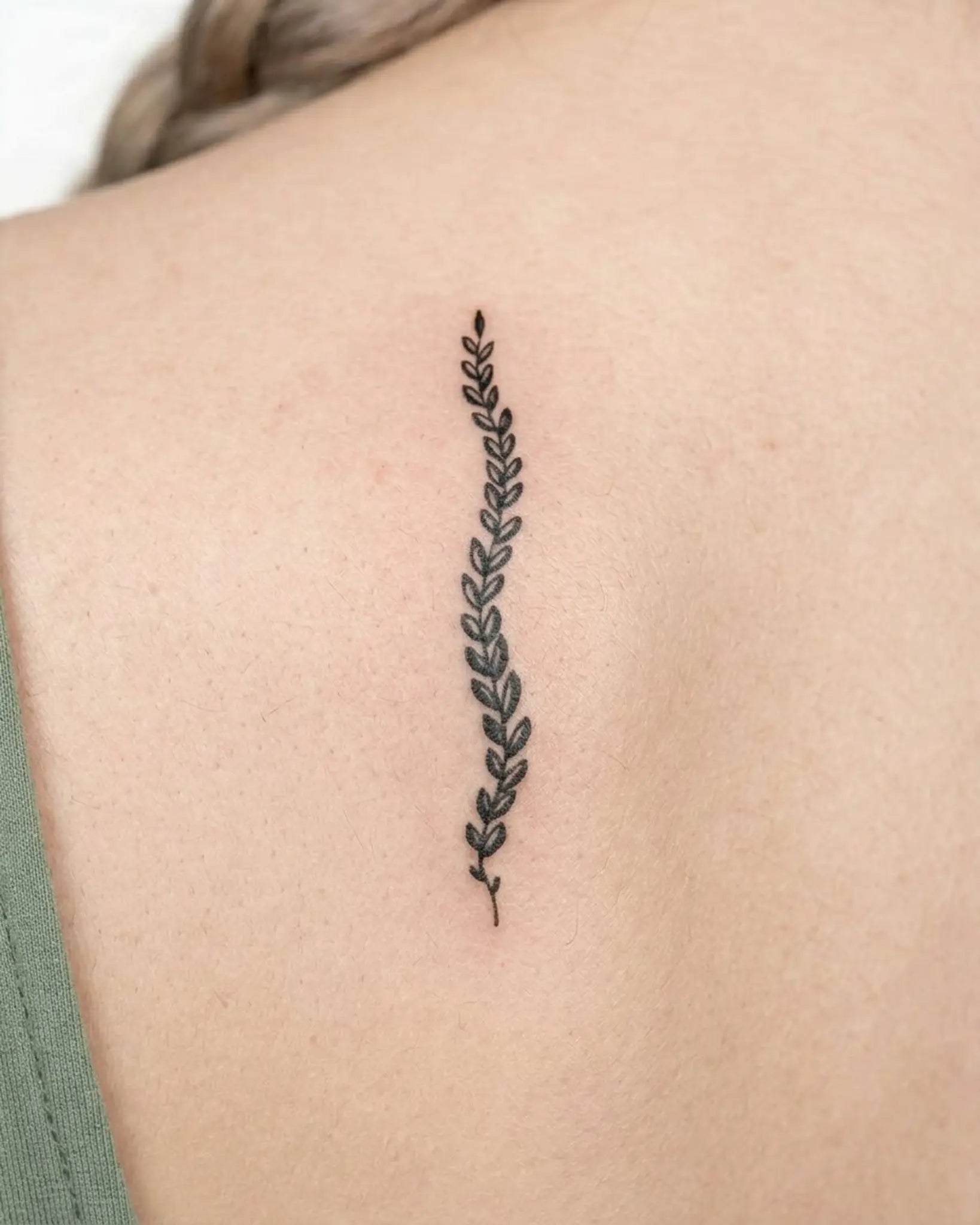 INKY Leafy Vine semi-permanent tattoo applied on a woman – 2 x 4 in (6x10 cm) design, realistic ink look, lasts 10 days