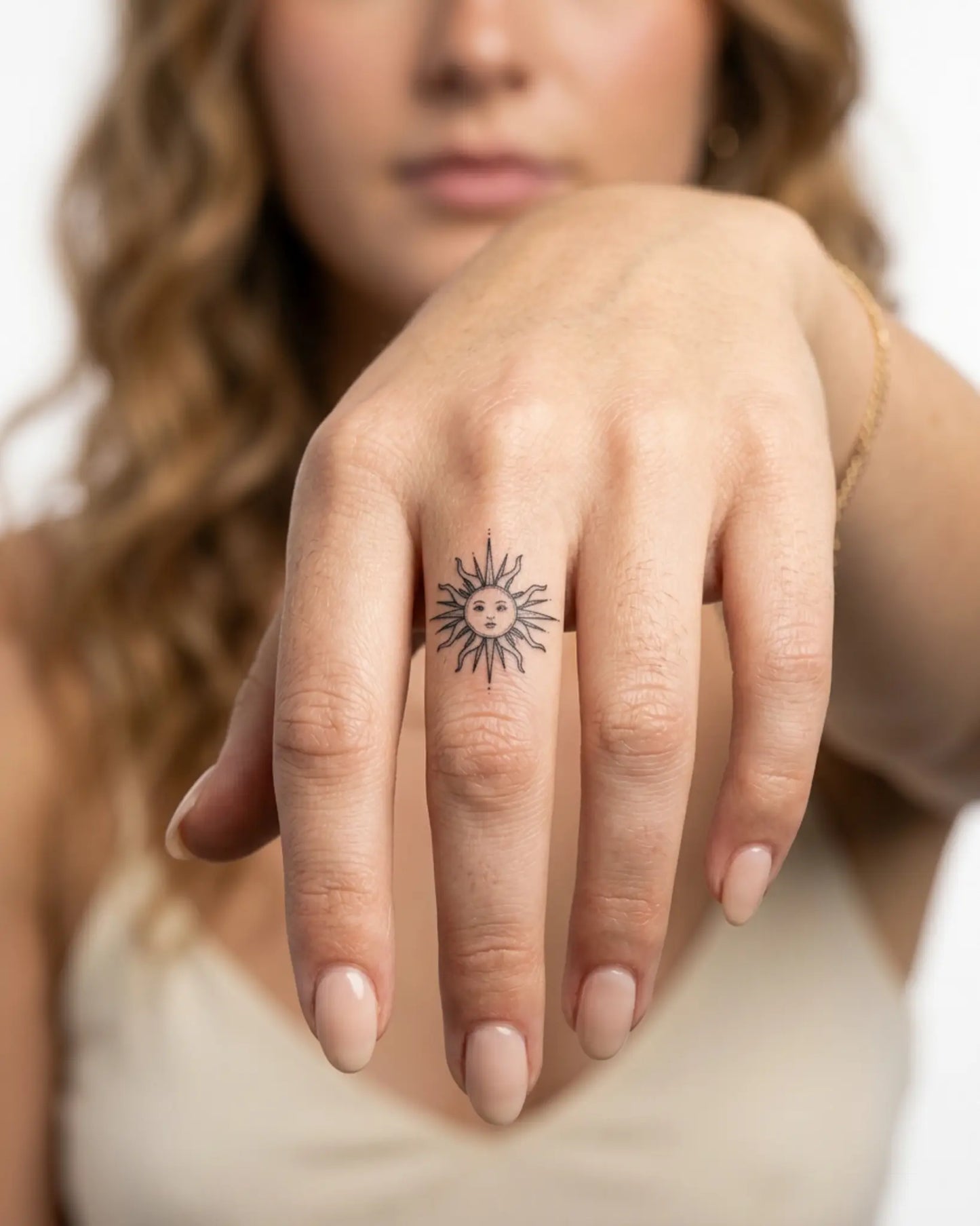 INKY Radiant Sol semi-permanent tattoo applied on a woman – 0.5 x 0.5 in (1x1 cm) design, realistic ink look, lasts 10 days