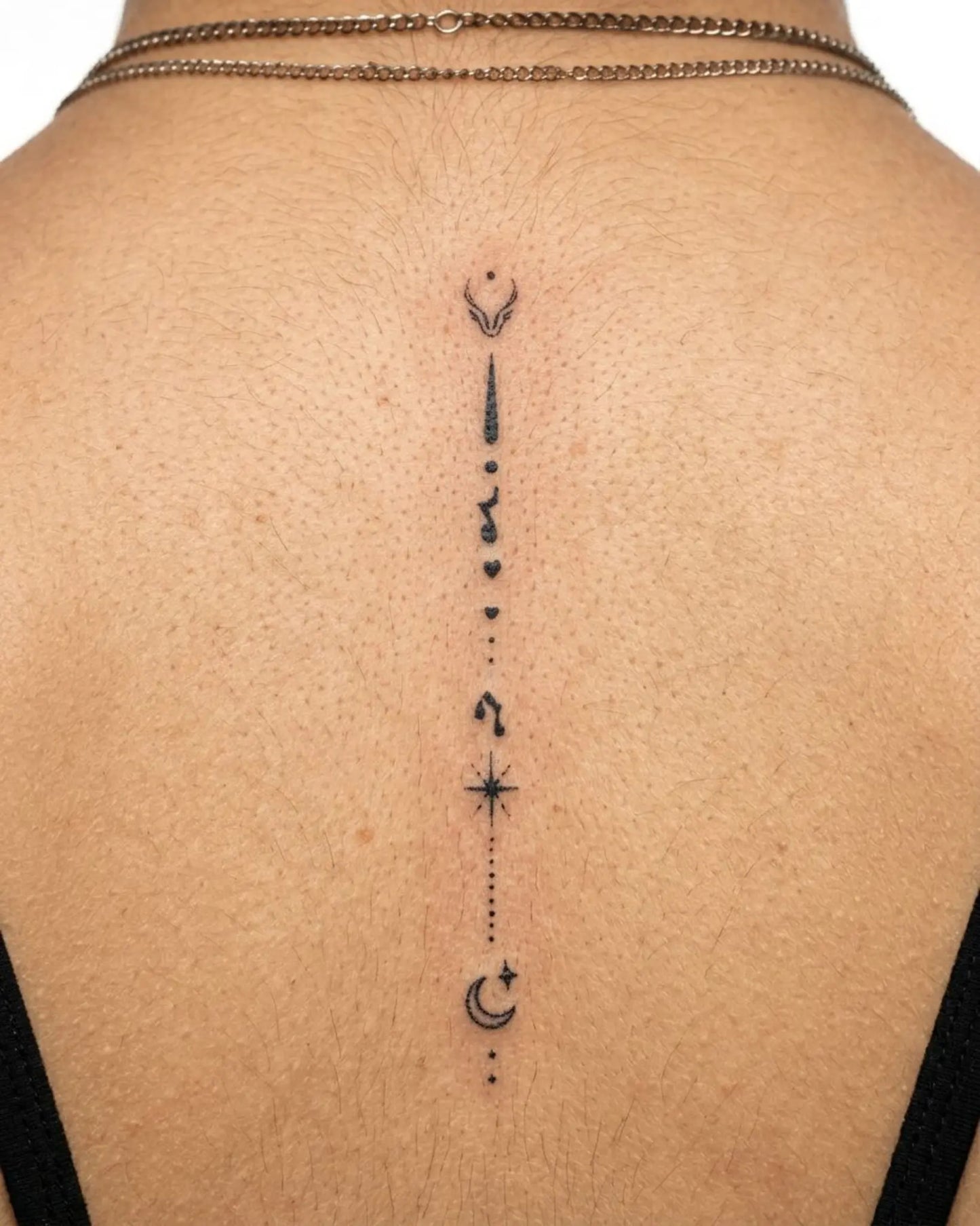 INKY Cosmic Flow semi-permanent tattoo applied on a woman – 2 x 4 in (6x10 cm) design, realistic ink look, lasts 10 days