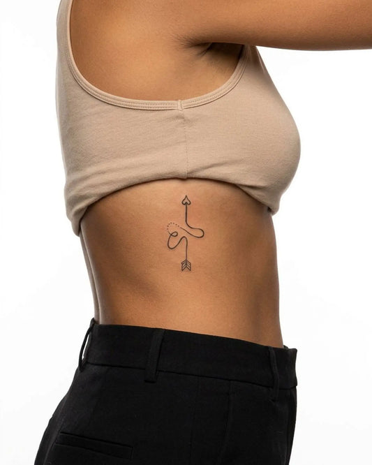 INKY S Heart Bow semi-permanent tattoo applied on a woman – 2 x 4 in (6x10 cm) design, realistic ink look, lasts 10 days