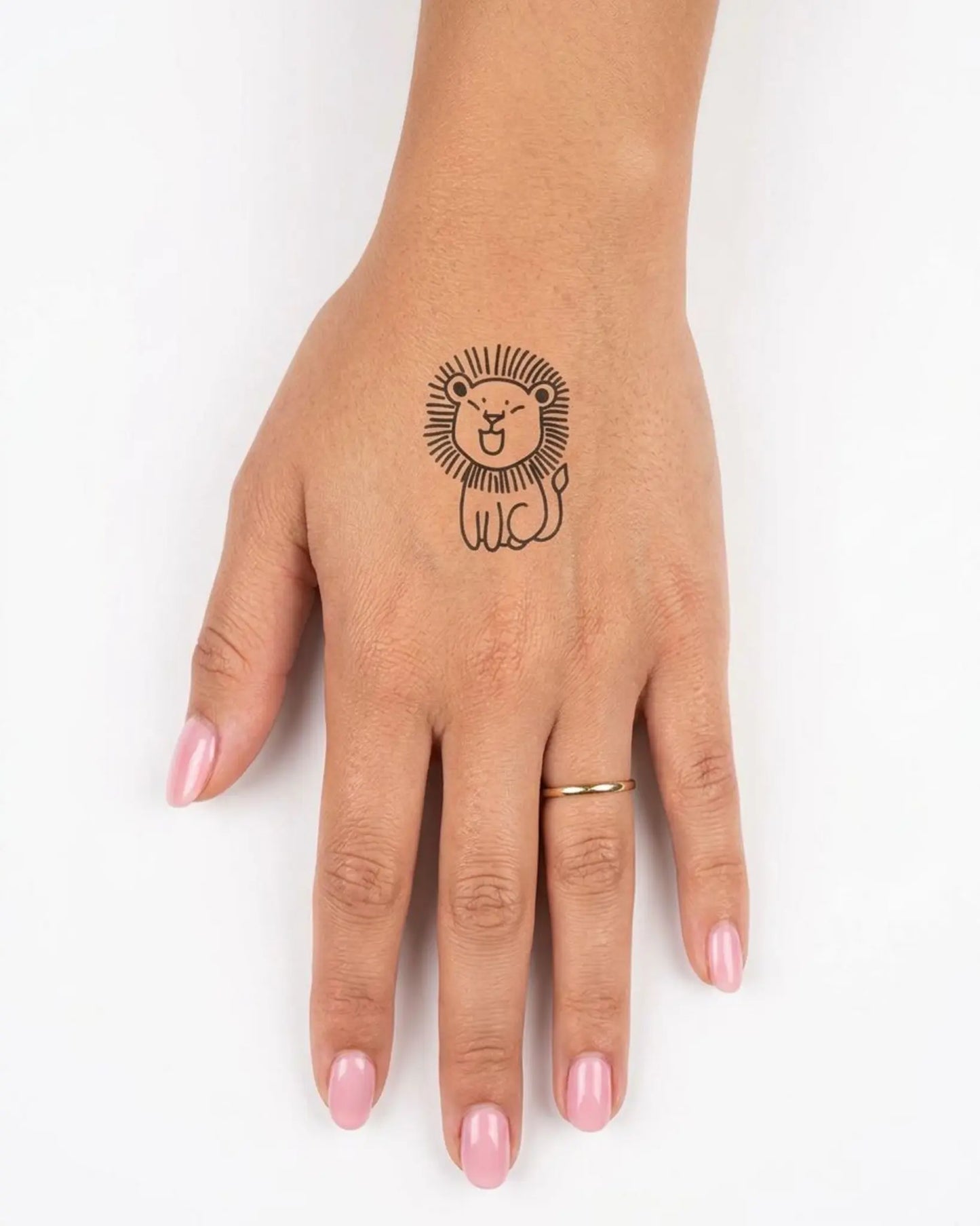 INKY Lion Doodle semi-permanent tattoo applied on a woman – 2 x 2 in (4x4 cm) design, realistic ink look, lasts 10 days