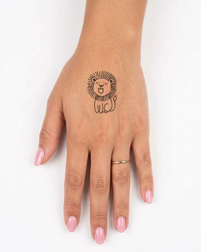 INKY Lion Doodle semi-permanent tattoo applied on a woman – 2 x 2 in (4x4 cm) design, realistic ink look, lasts 10 days