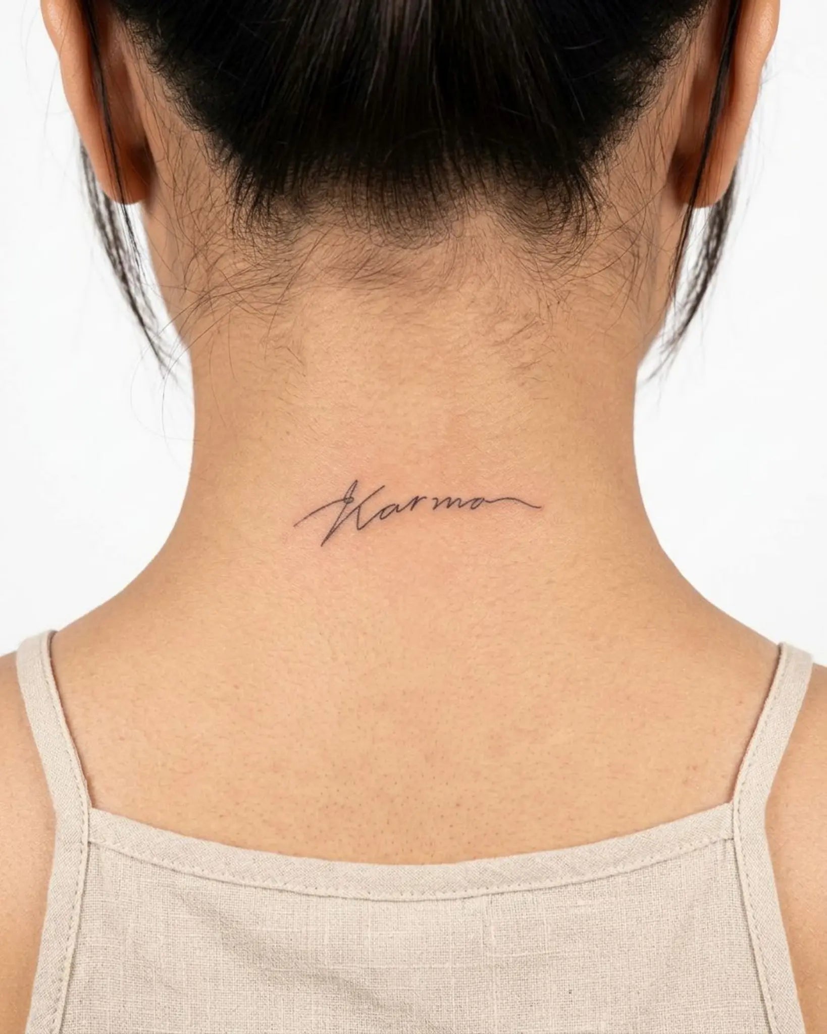 INKY Karma Script semi-permanent tattoo applied on a woman – 2 x 2 in (4x4 cm) design, realistic ink look, lasts 10 days