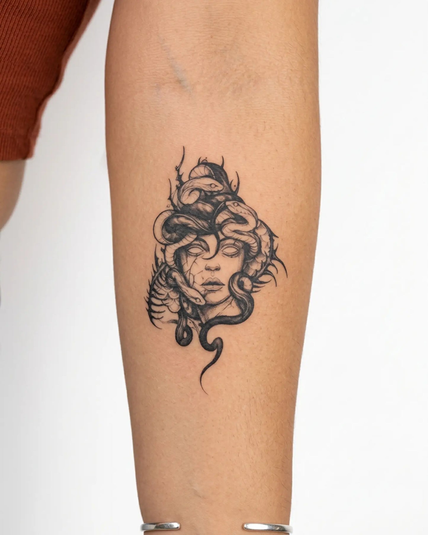 INKY Medusa Art 2 semi-permanent tattoo applied on a woman – 3 x 4 in (7x10 cm) design, realistic ink look, lasts 10 days