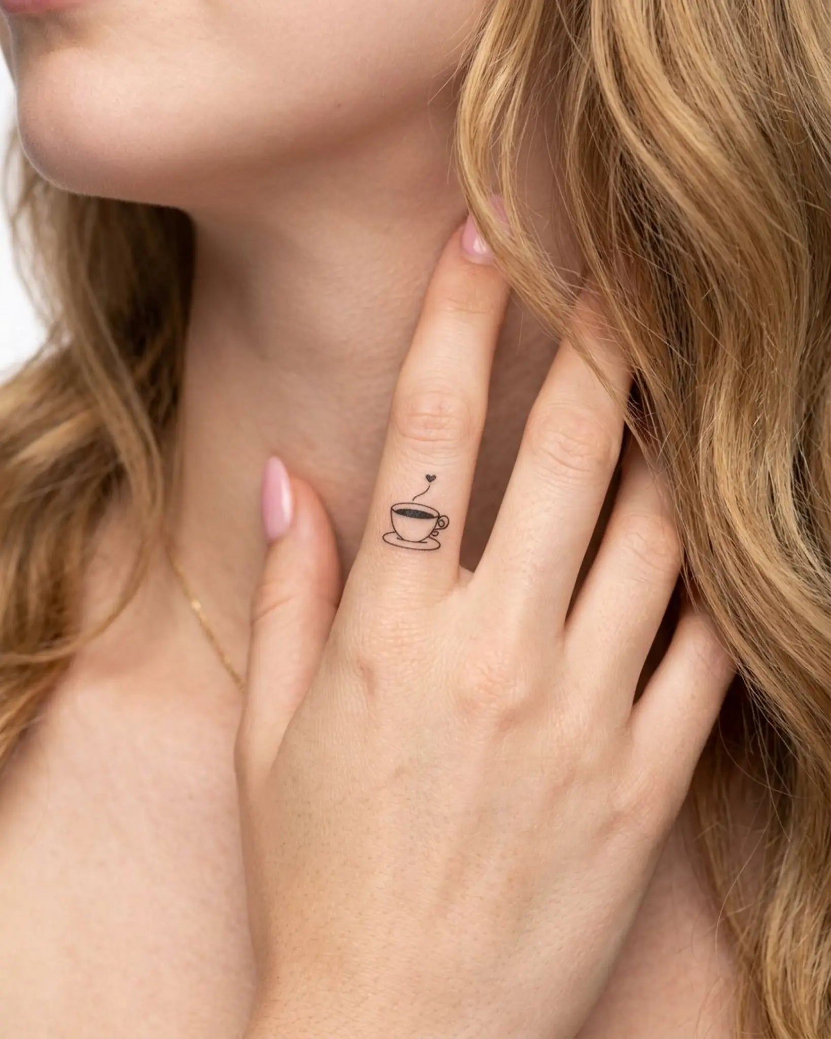 INKY Cuppa Love semi-permanent tattoo applied on a woman – 0.5 x 0.5 in (1x1 cm) design, realistic ink look, lasts 10 days