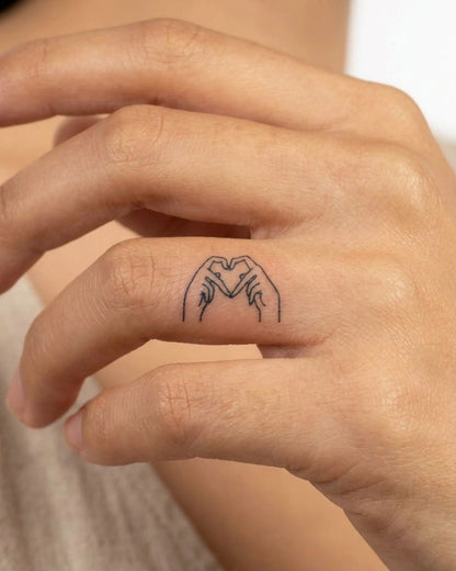 INKY Heart Hands semi-permanent tattoo applied on a woman – 0.5 x 0.5 in (1x1 cm) design, realistic ink look, lasts 10 days