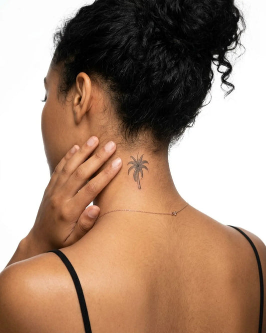 INKY Tropical Palm semi-permanent tattoo applied on a woman – 2 x 2 in (4x4 cm) design, realistic ink look, lasts 10 days