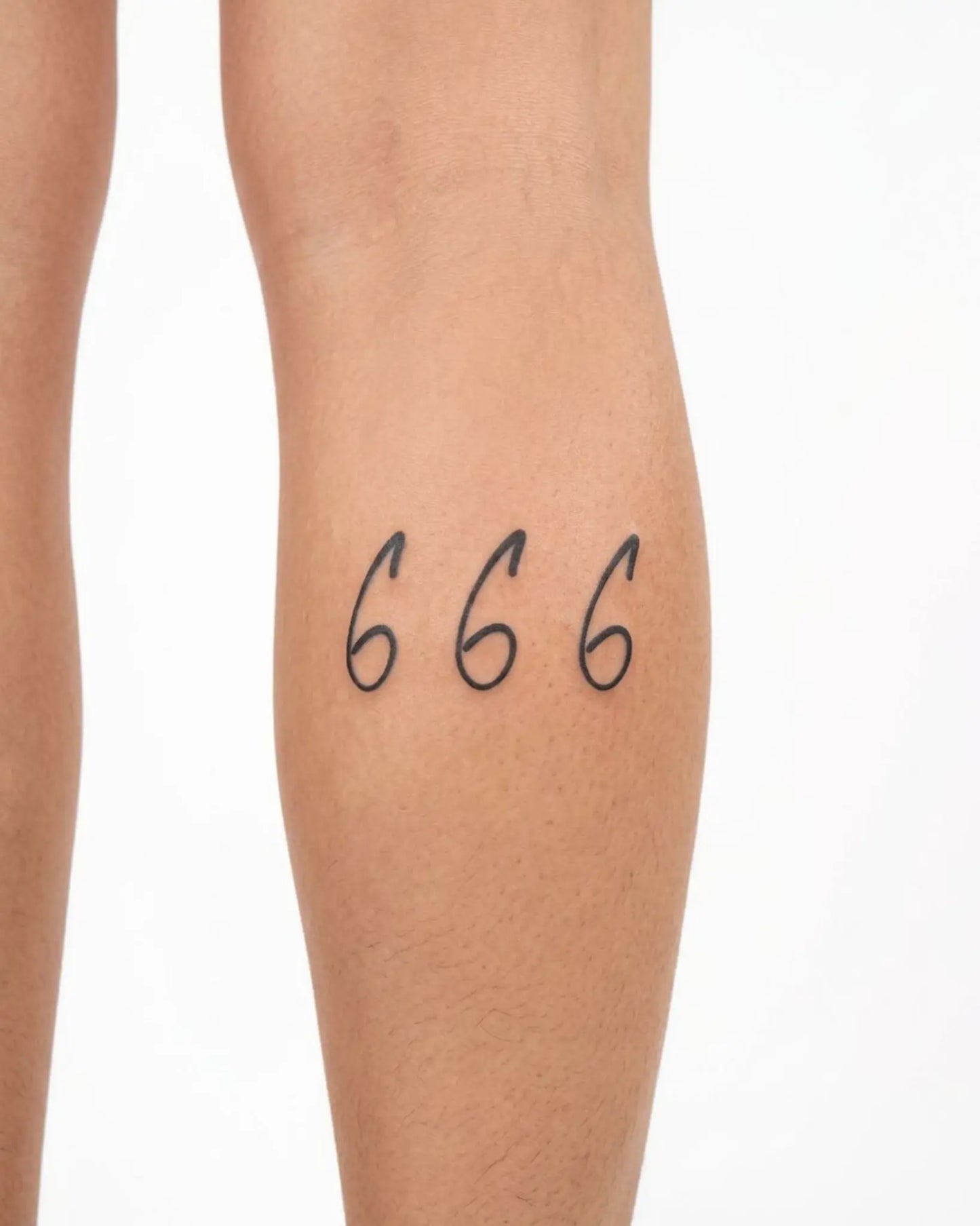 INKY Cursive 666 2 semi-permanent tattoo applied on a woman – 2 x 4 in (6x10 cm) design, realistic ink look, lasts 10 days