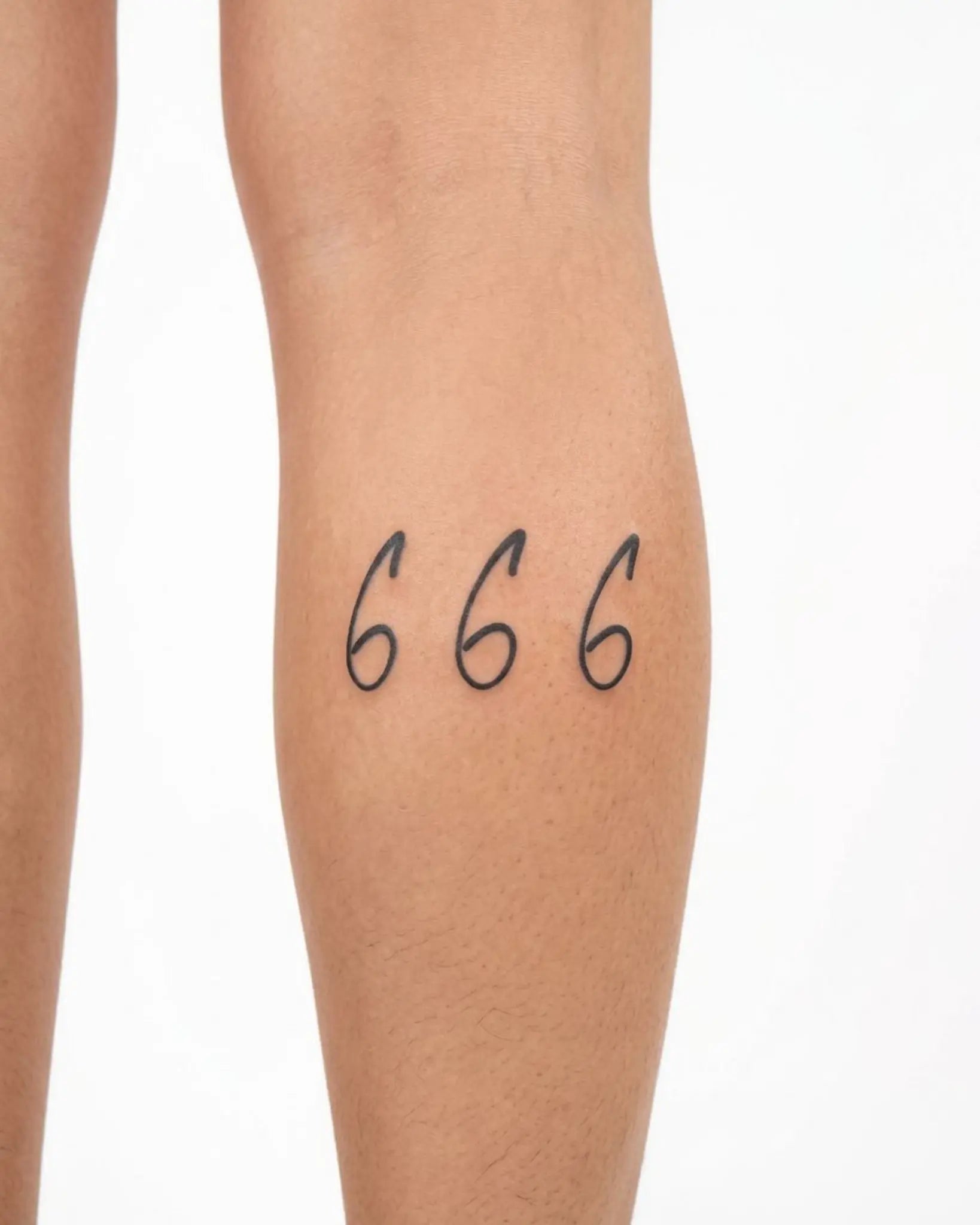 INKY Cursive 666 2 semi-permanent tattoo applied on a woman – 2 x 4 in (6x10 cm) design, realistic ink look, lasts 10 days