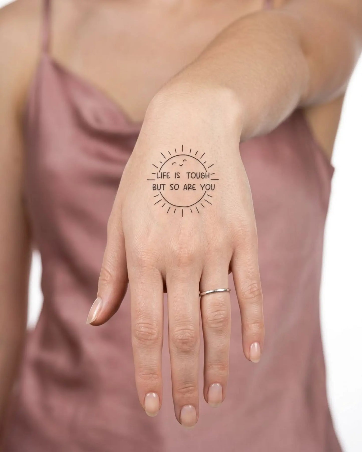 INKY Resilient Sun semi-permanent tattoo applied on a woman – 2 x 2 in (4x4 cm) design, realistic ink look, lasts 10 days